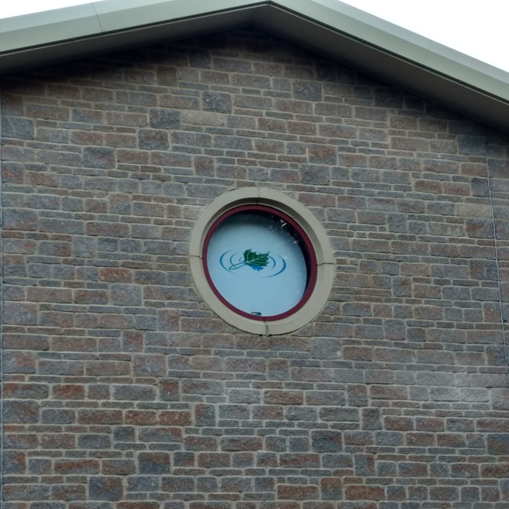 Float in the Forest logo in the circular window