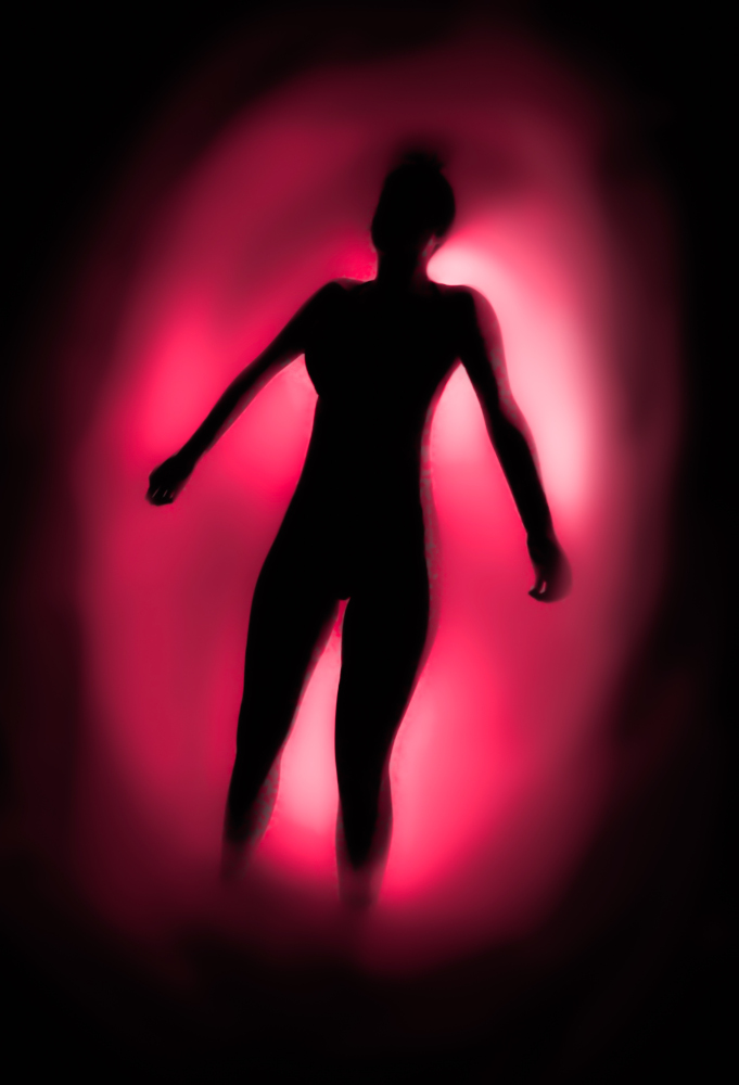 Glowing silhouette of a person floating